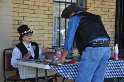 Mollie Davis signs up Jeff Thrash for the reenactment